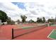 View of community tennis and pickleball courts surrounded by mature trees and landscaping at 2434 W Eugie Ave, Phoenix, AZ 85029