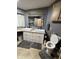 This bathroom has dual sinks, granite counters, updated fixtures, and a toilet with a closed lid at 2661 N Wright Way, Mesa, AZ 85215