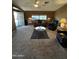 Inviting living room featuring neutral carpet, comfortable seating, and bright natural light at 2661 N Wright Way, Mesa, AZ 85215