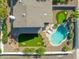 Aerial view of the backyard featuring a pool, seating, putting green, fire pit, and barbecue at 2818 N Yucca St, Chandler, AZ 85224