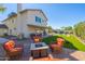 A backyard featuring a fire pit, lush lawn, barbecue, and seating area perfect for outdoor living at 2818 N Yucca St, Chandler, AZ 85224