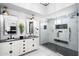 Luxury bathroom featuring double sink vanity, and glass enclosed shower with rainfall head at 2818 N Yucca St, Chandler, AZ 85224