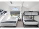 Cozy bedroom with bunk beds, large window, and sleek gray blinds at 2818 N Yucca St, Chandler, AZ 85224