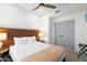 Cozy bedroom with neutral tones, ceiling fan, and modern decor at 2818 N Yucca St, Chandler, AZ 85224