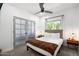 Bright bedroom featuring a comfortable bed, ceiling fan, and a window view at 2818 N Yucca St, Chandler, AZ 85224