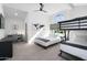 Spacious bedroom with bunk beds, a desk, and a modern ceiling fan at 2818 N Yucca St, Chandler, AZ 85224