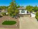 Exterior elevation with well-maintained landscaping, mature trees, and a multi-car garage at 2818 N Yucca St, Chandler, AZ 85224