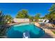 Swimming pool with diving board, surrounded by lush landscaping and lounge chairs, perfect for relaxing at 2818 N Yucca St, Chandler, AZ 85224
