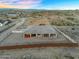 Expansive desert home features an attached garage and covered patio with desert landscaping at 28204 N Royce Rd, Queen Creek, AZ 85144