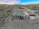 Aerial view of serene desert home with beautiful natural desert surroundings and open space at 28204 N Royce Rd, Queen Creek, AZ 85144