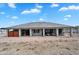 This home features a covered patio, desert landscaping, and plenty of backyard space at 28204 N Royce Rd, Queen Creek, AZ 85144
