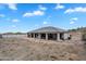 This home features a covered patio, desert landscaping, and plenty of backyard space at 28204 N Royce Rd, Queen Creek, AZ 85144