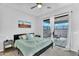 Bedroom with bright natural light and sliding glass doors opening to a covered patio at 28204 N Royce Rd, Queen Creek, AZ 85144