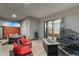 Relaxing covered patio with hot tub, fire pit, and comfortable lounge chairs at 28204 N Royce Rd, Queen Creek, AZ 85144