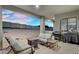 Spacious covered patio offers a comfortable lounge area with a grill perfect for outdoor gatherings at 28204 N Royce Rd, Queen Creek, AZ 85144