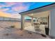 Large covered patio with dining and seating areas providing an ideal space for outdoor entertainment at 28204 N Royce Rd, Queen Creek, AZ 85144