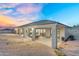 Extended covered patio with lounge furniture, grill and recessed lighting at 28204 N Royce Rd, Queen Creek, AZ 85144