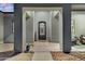 A covered entrance with a decorative door and a welcoming welcome sign at 28204 N Royce Rd, Queen Creek, AZ 85144