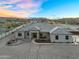 Stunning aerial view of home featuring desert landscaping, fire pit, and inviting outdoor seating area at 28204 N Royce Rd, Queen Creek, AZ 85144