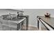 Modern laundry room with front loading washer and dryer and storage cabinet at 28204 N Royce Rd, Queen Creek, AZ 85144