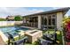 Relaxing backyard with a stylish fire pit and comfortable seating, perfect for outdoor gatherings at 2900 E Spring Wheat Ln, Gilbert, AZ 85296