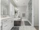 Spacious bathroom with a luxurious tub, double sinks, and a glass-enclosed shower featuring tile at 2900 E Spring Wheat Ln, Gilbert, AZ 85296