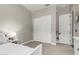 Neutral bedroom with a sliding door closet and bright white trim at 2900 E Spring Wheat Ln, Gilbert, AZ 85296