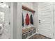 Inviting entryway featuring a built-in bench, coat hooks, and storage baskets, creating a welcoming atmosphere at 2900 E Spring Wheat Ln, Gilbert, AZ 85296