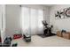Home gym featuring fitness equipment, weights, and a bright window view at 2900 E Spring Wheat Ln, Gilbert, AZ 85296