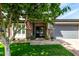 Inviting front entry with brick pillars, a brick walkway, and an American flag at 2900 E Spring Wheat Ln, Gilbert, AZ 85296