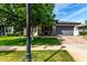 Charming single-story home featuring a well-manicured lawn and a two-car garage at 2900 E Spring Wheat Ln, Gilbert, AZ 85296