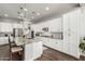 Modern kitchen featuring granite countertops, stainless steel appliances, white cabinetry, and a kitchen island at 2900 E Spring Wheat Ln, Gilbert, AZ 85296
