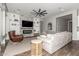 Inviting living room with brick fireplace, ceiling fan, and plush sofas for relaxing at 2900 E Spring Wheat Ln, Gilbert, AZ 85296