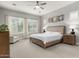 Bright main bedroom with plantation shutters, neutral color scheme, and ceiling fan, plus ample light at 2900 E Spring Wheat Ln, Gilbert, AZ 85296