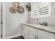 Office nook area featuring granite countertops, white cabinetry, window with plantation shutters, and decorative elements at 2900 E Spring Wheat Ln, Gilbert, AZ 85296