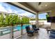 Outdoor patio with comfortable seating overlooking the pool and manicured backyard at 2900 E Spring Wheat Ln, Gilbert, AZ 85296