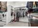 Bright walk-in closet offering ample storage with built-in shelving and organization systems at 2900 E Spring Wheat Ln, Gilbert, AZ 85296