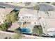 Aerial view of the home's backyard, including a refreshing pool and lush landscaping offering a private outdoor oasis at 3557 S Halsted Ct, Chandler, AZ 85286