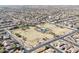 Expansive aerial shot of the community, showcasing a vast green park and neatly arranged residential homes at 3557 S Halsted Ct, Chandler, AZ 85286