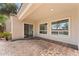Back patio features brick pavers, and provides convenient access to the interior through sliding doors and large windows at 3557 S Halsted Ct, Chandler, AZ 85286
