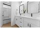 Clean bathroom features double sinks and a shower/tub combination at 3557 S Halsted Ct, Chandler, AZ 85286