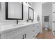 Elegant bathroom featuring double sinks, vanity with a quartz countertop and modern matte black faucets at 3557 S Halsted Ct, Chandler, AZ 85286