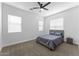 Inviting bedroom with a ceiling fan, plush carpet, and ample natural light for a cozy atmosphere at 3557 S Halsted Ct, Chandler, AZ 85286