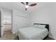 A secondary bedroom includes a queen-sized bed, ceiling fan, and closet at 3557 S Halsted Ct, Chandler, AZ 85286