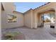 Beautiful courtyard with arched entrance, brick pavers, a small palm, and view of the street at 3557 S Halsted Ct, Chandler, AZ 85286