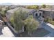 Beautiful two-story home with manicured landscaping, a tiled roof, and a welcoming entry surrounded by mature trees at 3557 S Halsted Ct, Chandler, AZ 85286
