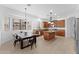 Spacious eat-in kitchen with an island, pendant lighting, stainless steel appliances, and a dining table at 3557 S Halsted Ct, Chandler, AZ 85286