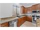 Kitchen showcasing granite countertops, stainless appliances, a dishwasher, sink, and custom cabinetry at 3557 S Halsted Ct, Chandler, AZ 85286