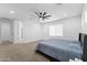 Bedroom with carpet and a ceiling fan, offers a comfortable retreat with ample natural light at 3557 S Halsted Ct, Chandler, AZ 85286