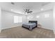 Spacious bedroom with neutral walls, carpet, a ceiling fan, and ample natural light at 3557 S Halsted Ct, Chandler, AZ 85286